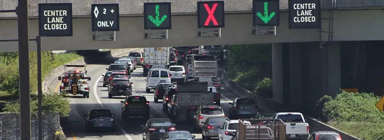 A set of variable-message signs on Interstate 90 in Mercer Island, Washington, informing drivers of an upcoming lane closure.